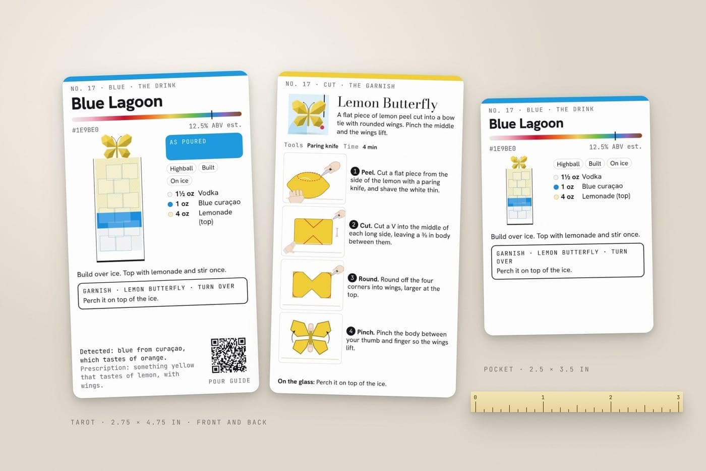 The pocket card beside a tarot-size card, front and back, with a ruler for scale.